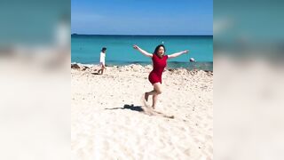 Most good Butts: Korean chick frolicking on the beach...