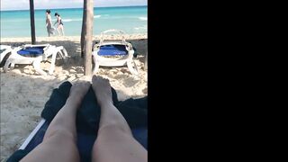 She fingers her pussy at the beach