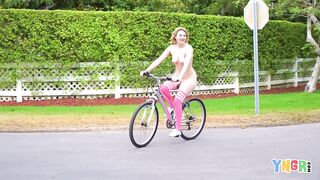 Big titted Kinsley Anne rides a bike naked in the middle of the street