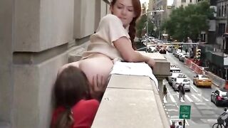 Getting her ass eaten on the balcony