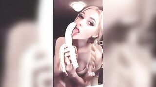 Braided blonde licking banana
